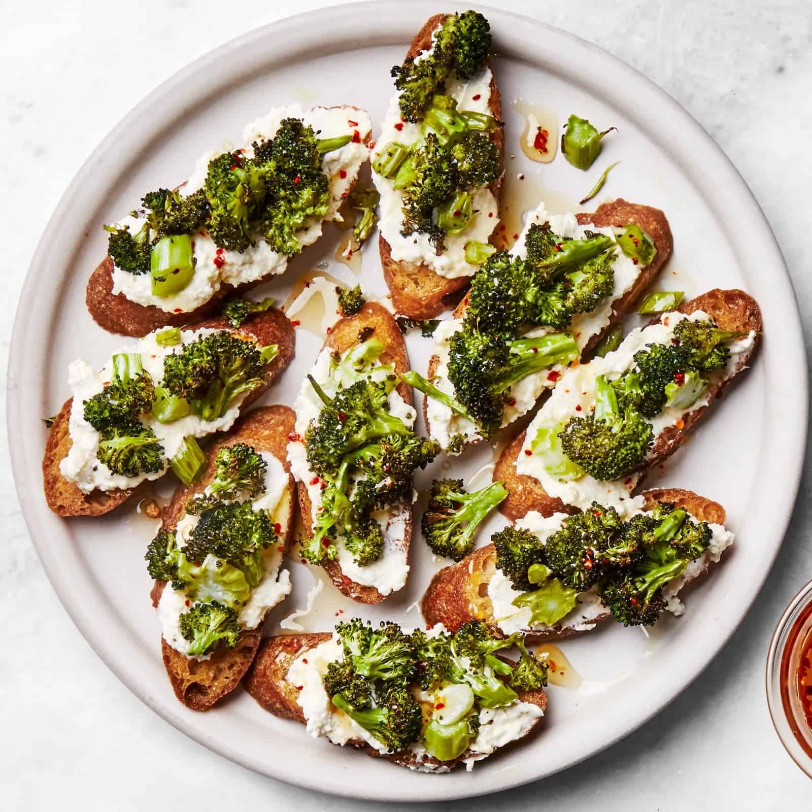 Broccoli and Garlic-Ricotta Toasts With Hot Honey