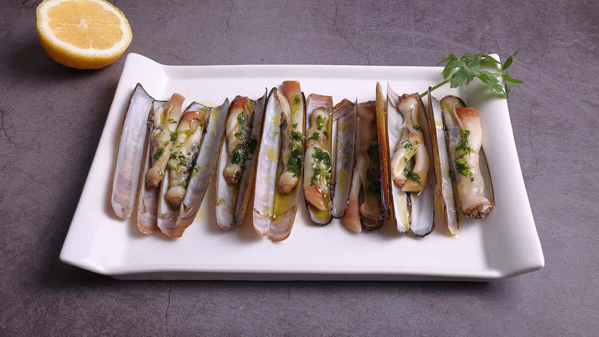 Steamed Razor Clams With Ramps And White Wine