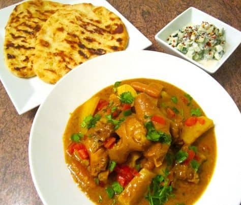 Pigtails And Potato Curry, Naan & Cucumber Raita